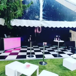 60th birthday party with pink bar and checkerboard dancefloor.