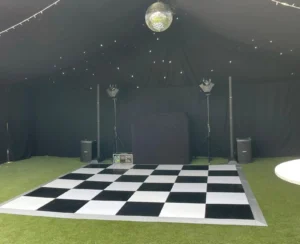 Checkerboard dance floor on astro turf.