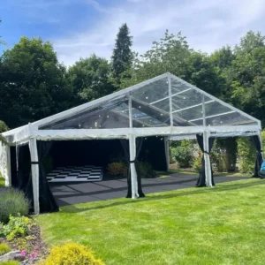 Clear span marquee on green lawn.