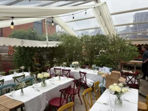 Interior of hospitality clearspan marquee covering extended dining area.