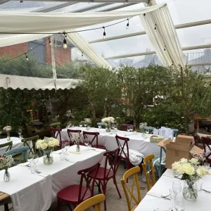 Interior of hospitality clearspan marquee covering extended dining area.
